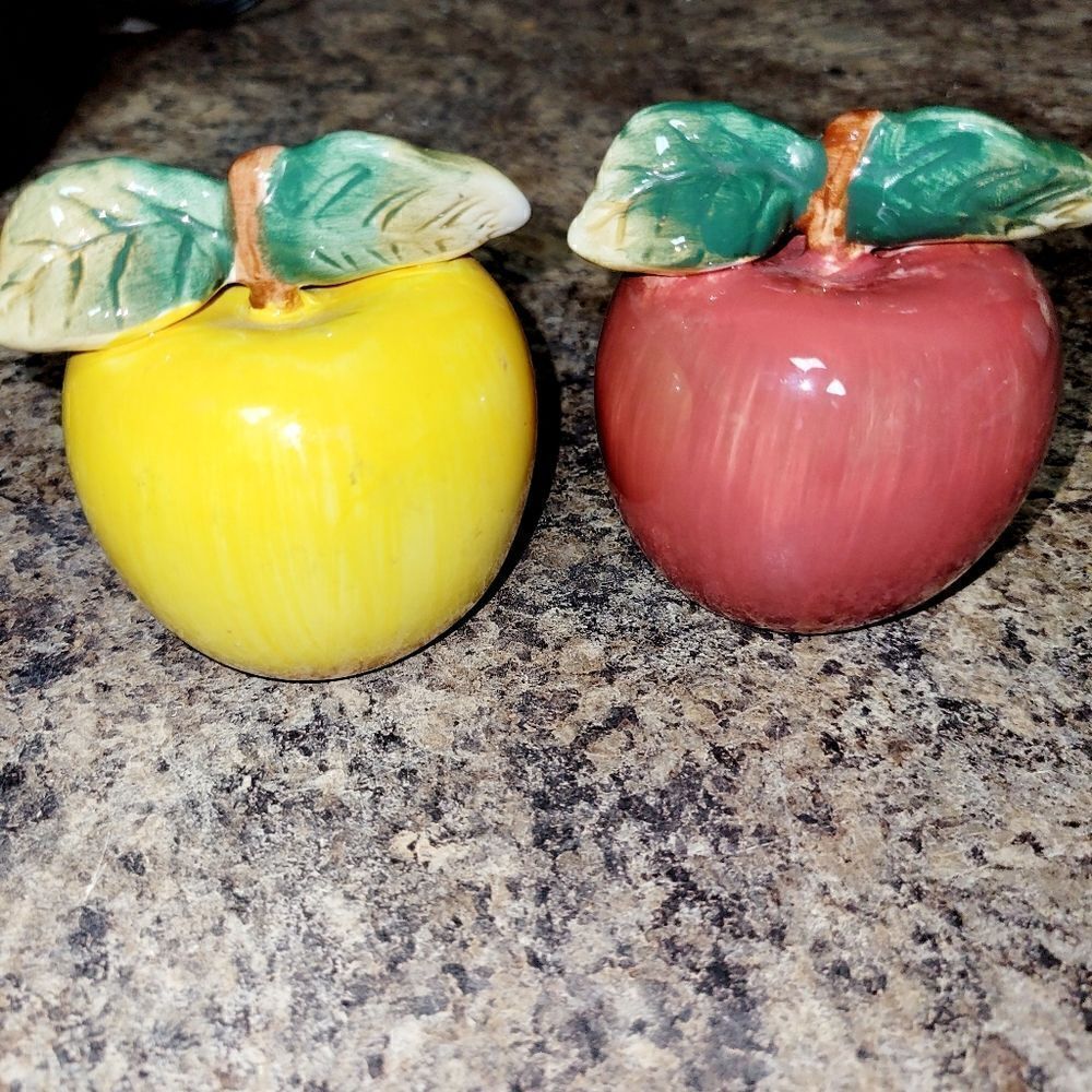 A set of apple salt and pepper shakers. ^
